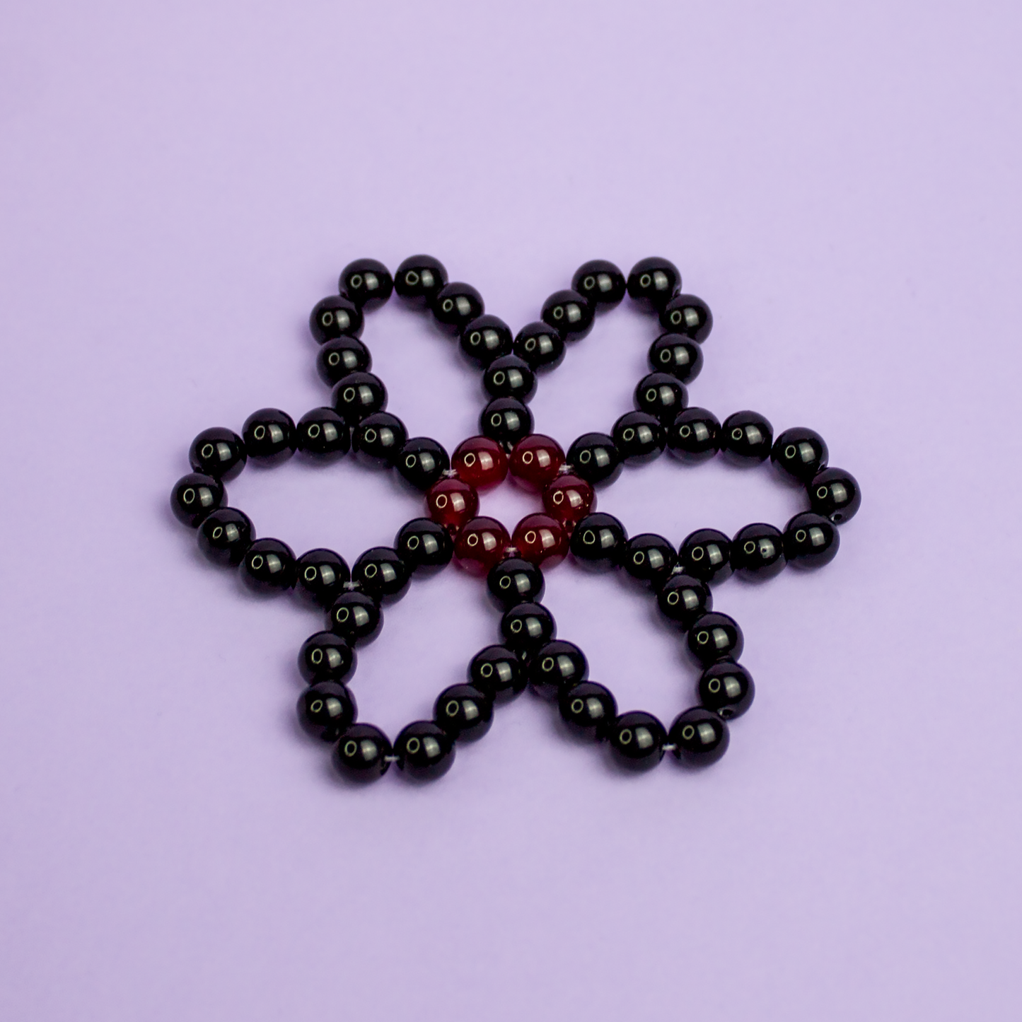 Dessous de verre Marguerite noire